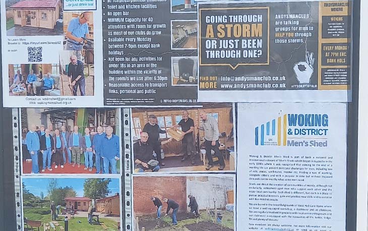 a window display images and information of three local groups that support men's mental health and wellbeing.